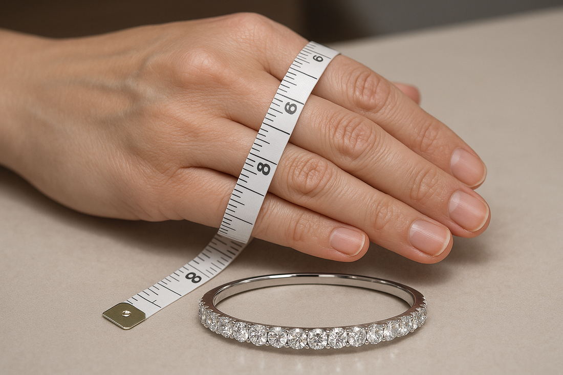 A hand demonstrating how to measure bangle size using a measuring tape around the widest part of the knuckles, with a sparkling Xazina lab-grown diamond bangle in the foreground, symbolizing accurate jewellery sizing.